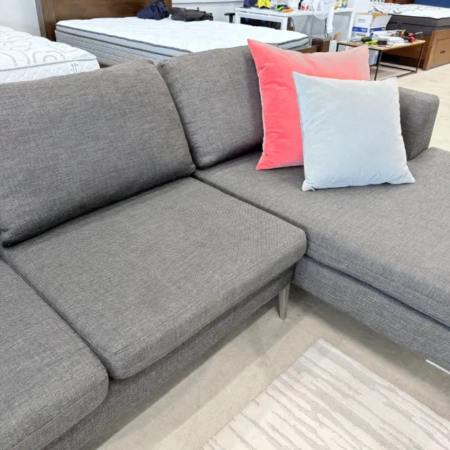 Seat and back cushions of the Freedom L shape sofa in dark grey fabric