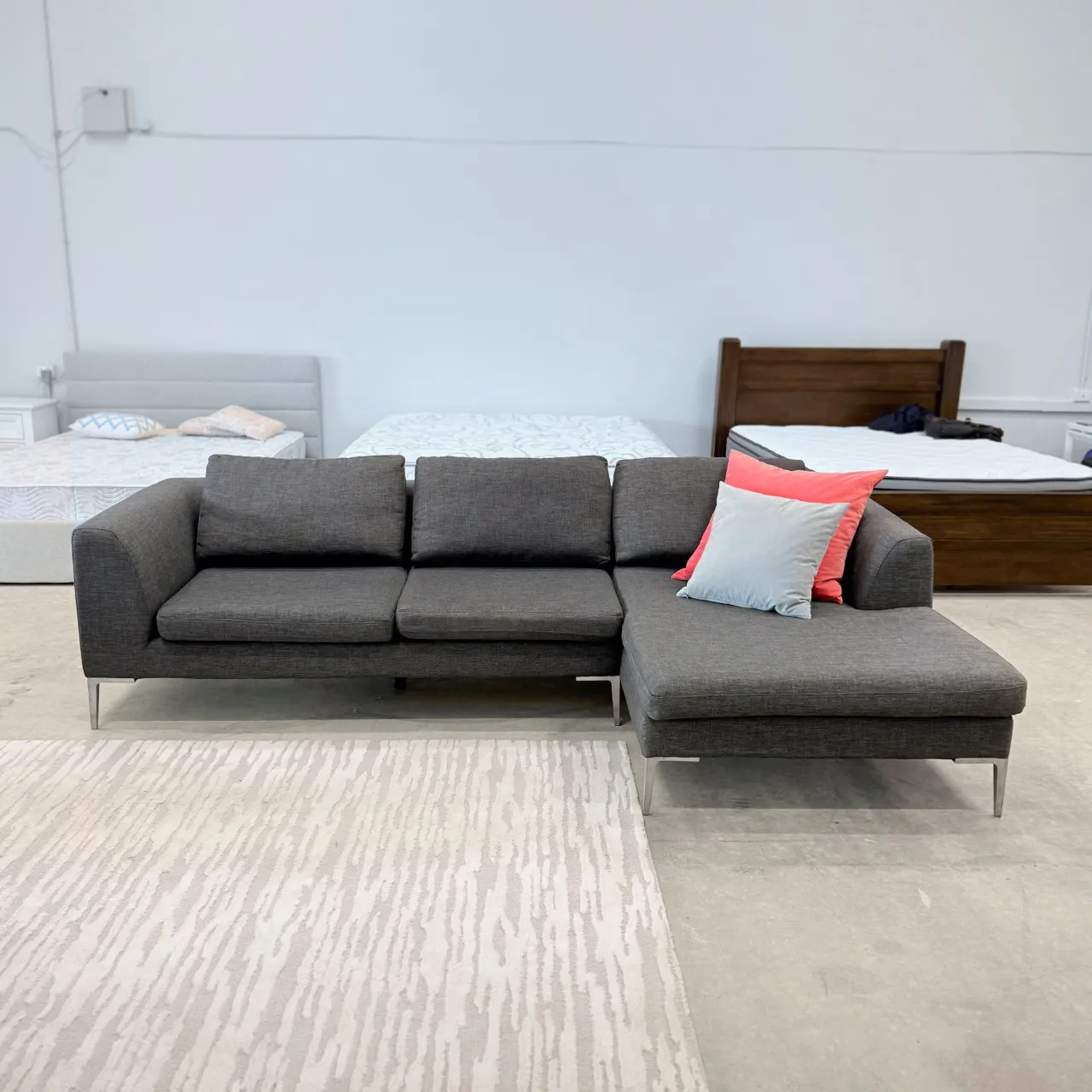 Freedom L shape chaise sofa from the front, showing the full 2.85 m width and slim metal legs