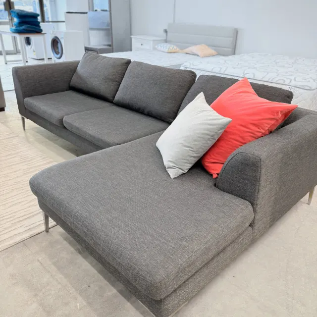 Freedom chaise sofa from the chaise end: long chaise and slim arm in dark grey woven fabric