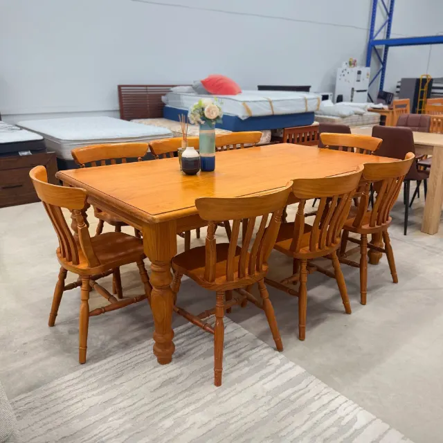 Honey pine dining table and 8 chairs from the left