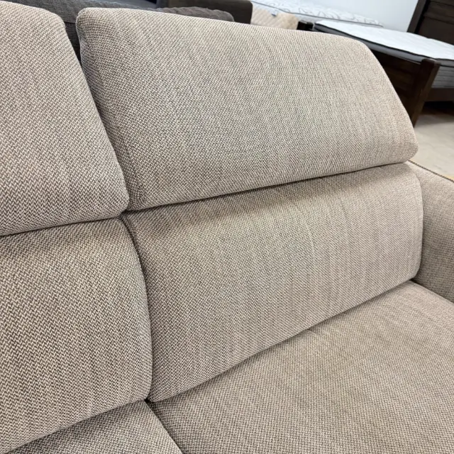 Close-up of the adjustable headrests and back cushions in light grey weave