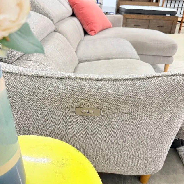 Power recline buttons on the outer arm of the Freedom sofa