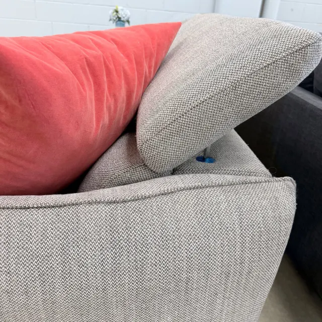Adjustable headrest of the Freedom sofa tilted forward