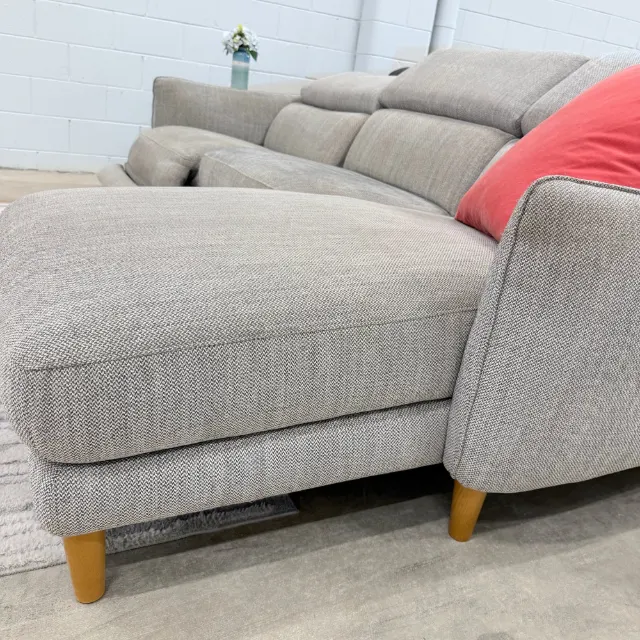 Chaise and arm from the side, light grey textured fabric and timber legs