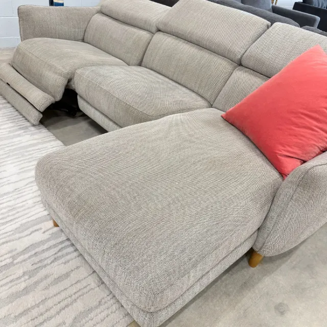 Long chaise of the Freedom sofa with the recliner seat open behind