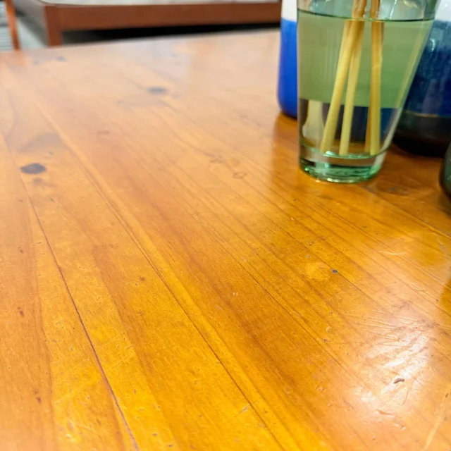 Honey pine top of the coffee table, grain and knots up close