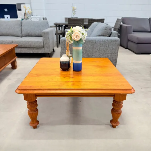 Square pine coffee table, front view showing the turned legs