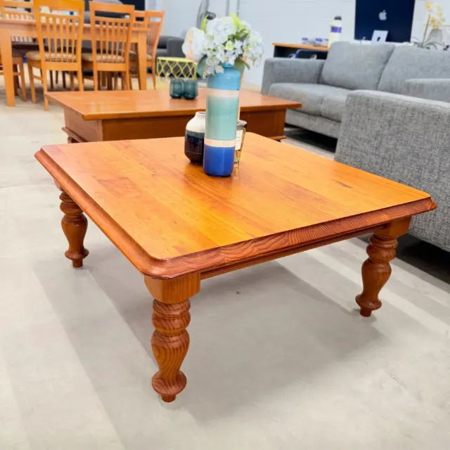 Square pine coffee table seen from the corner