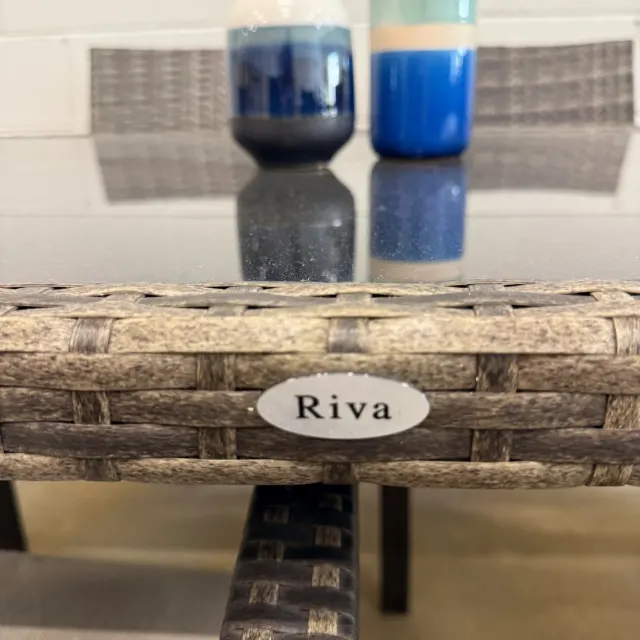 Riva badge on the wicker table edge