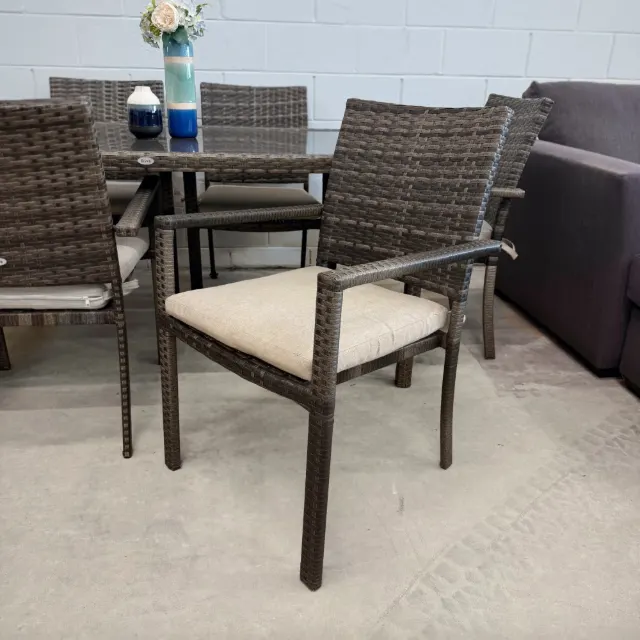 Riva wicker armchair with beige seat cushion, three-quarter view