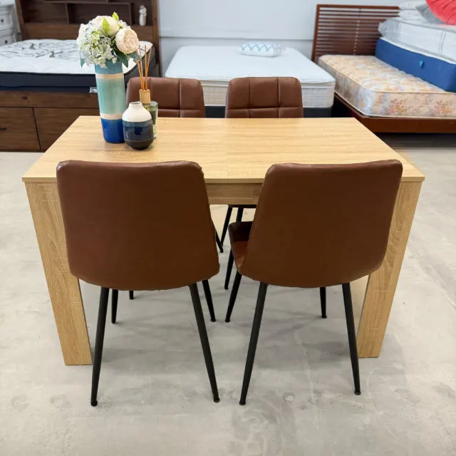 Oak look dining table with 4 tan faux leather chairs, front view