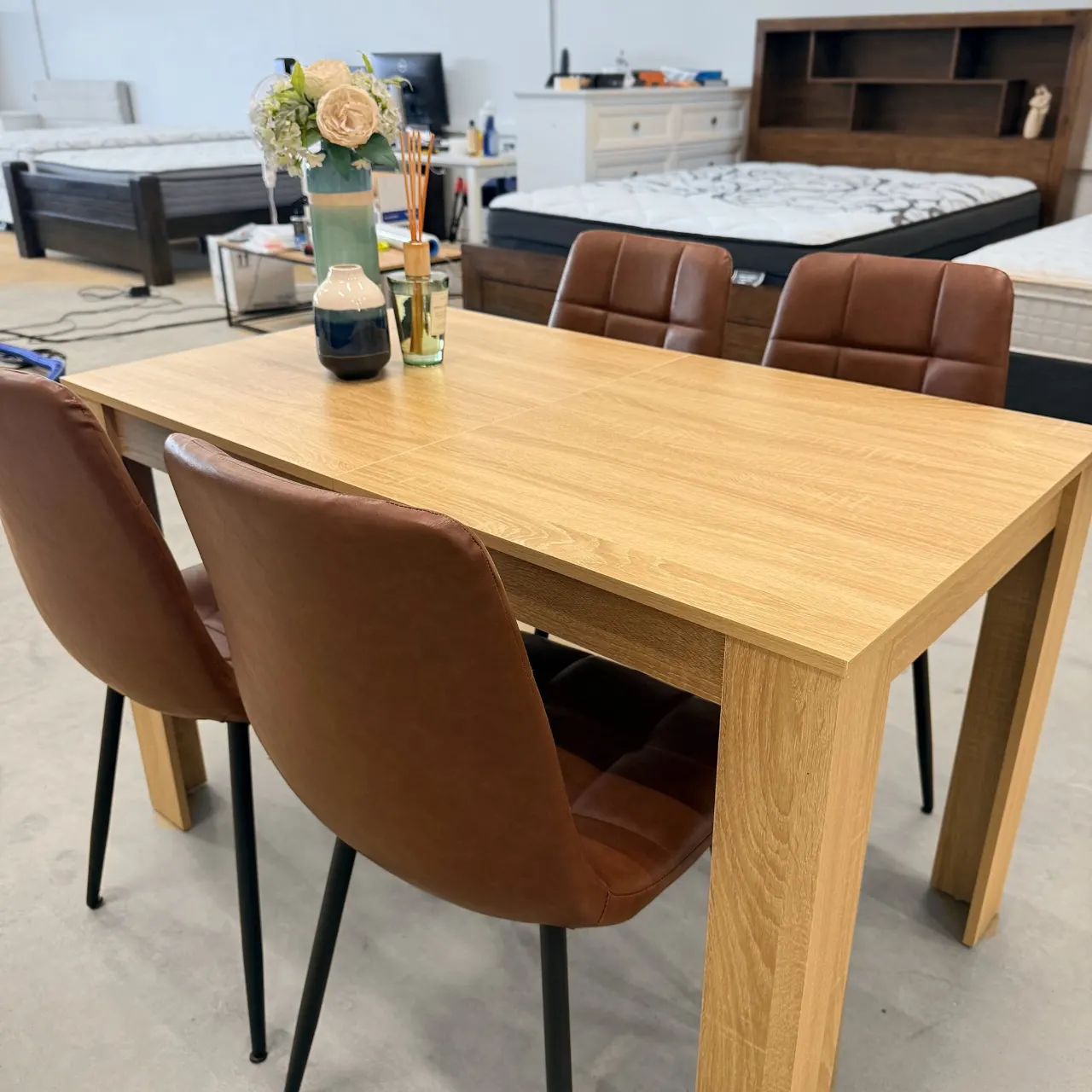 Dining set from the right: oak look table and tan quilted chairs