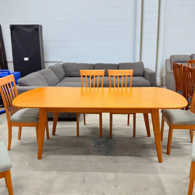 Dining table extended with its matching leaf in place