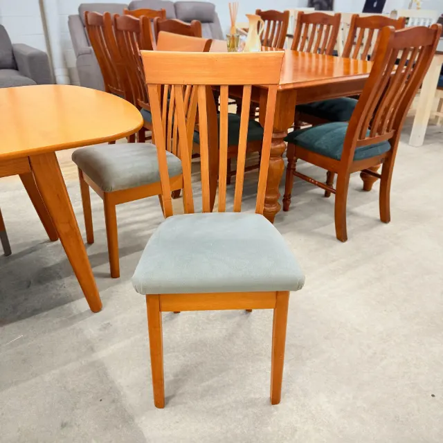 High-back dining chair with slatted back and padded grey seat, front view