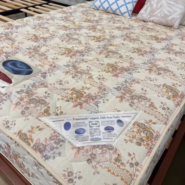 Sealy Posturepedic queen mattress with a floral quilted cover