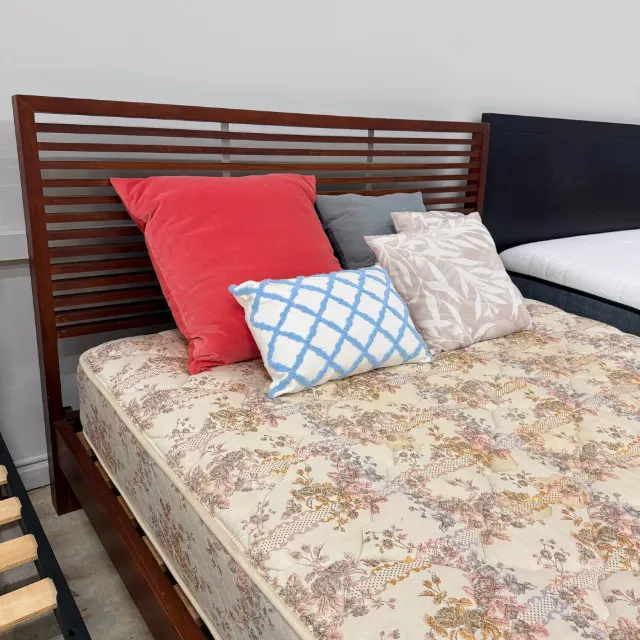 Slatted walnut headboard with the Sealy mattress and cushions