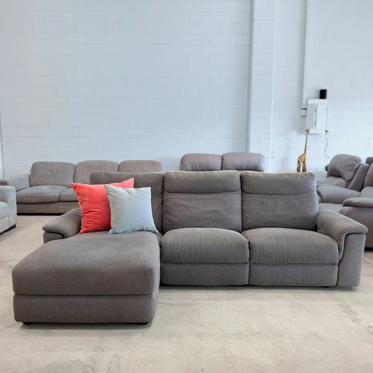 Grey fabric L shape electric recliner sofa, front view