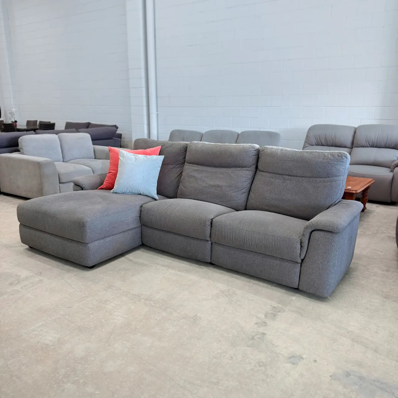 Grey L shape recliner sofa, angled view
