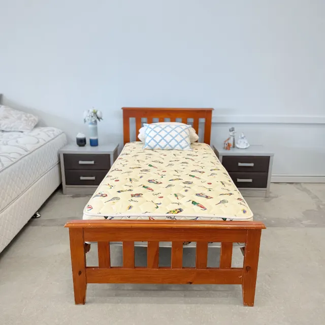 Single mattress on the matching timber single bed, front view