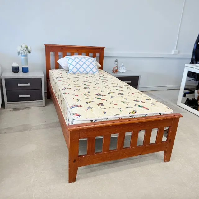Single mattress on the timber bed, side view