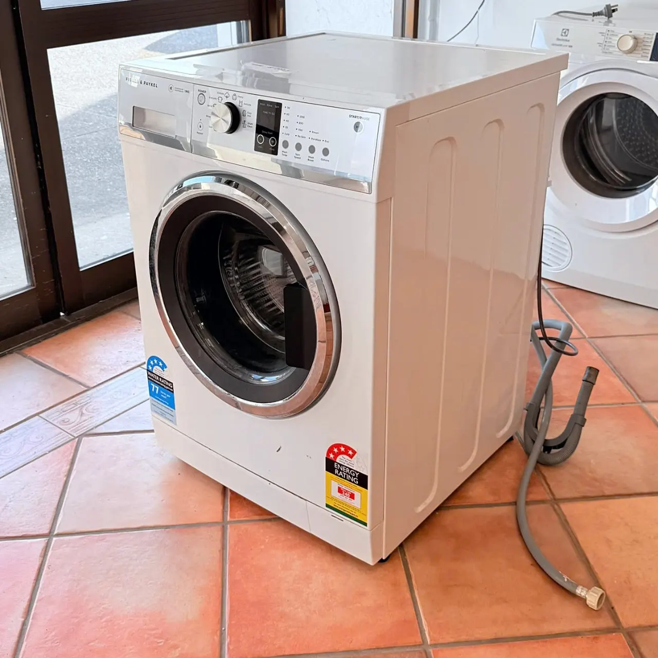 Fisher & Paykel 9kg washer, left side angle