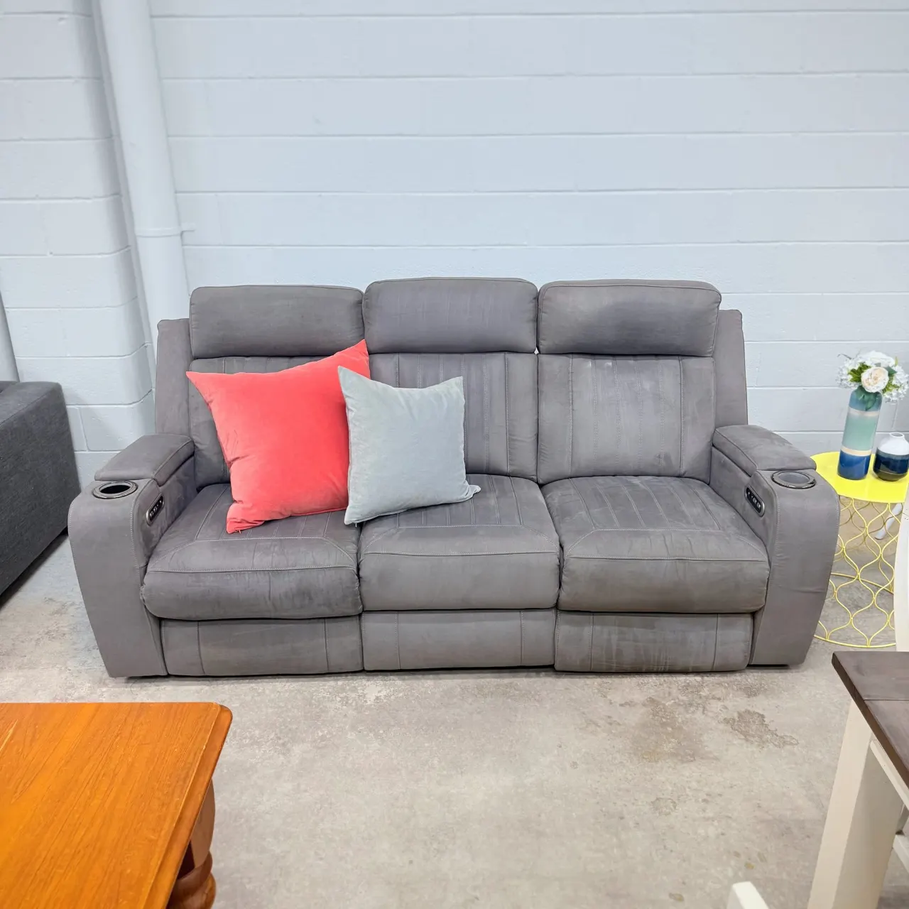 Grey 3 seater electric recliner sofa, front view with cushions