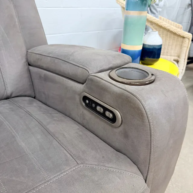 Arm with the recline buttons and a cup holder