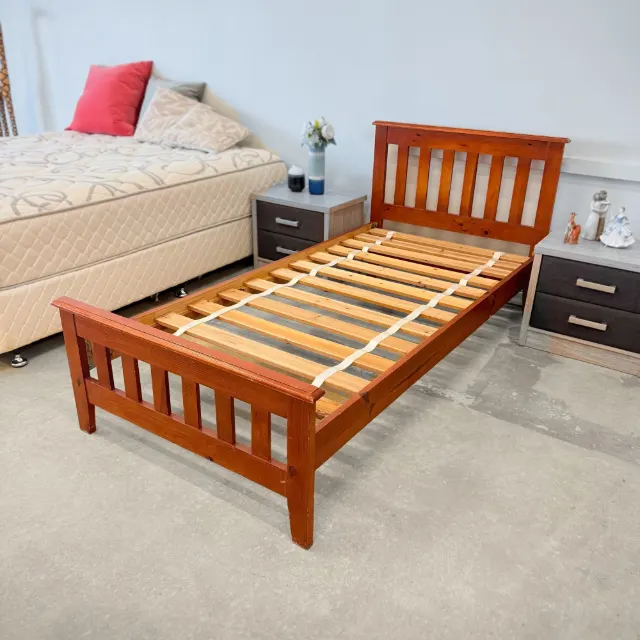 Single bed frame from the foot corner, slatted footboard