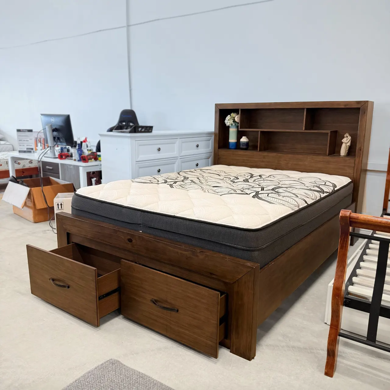 Queen storage bed with mattress, angled view of the bookcase headboard and side rail