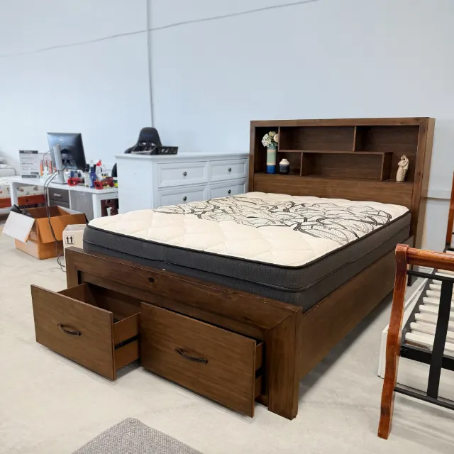 Queen storage bed with mattress, angled view of the bookcase headboard and side rail
