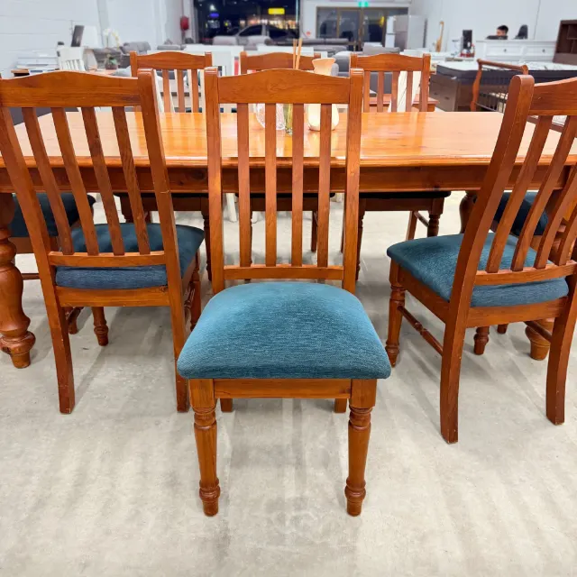 High-back timber dining chair with padded teal seat, front view