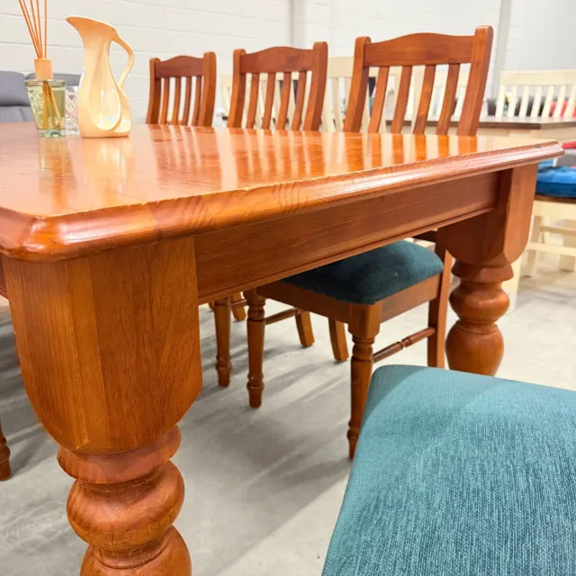 Corner of the farmhouse table with its chunky turned leg