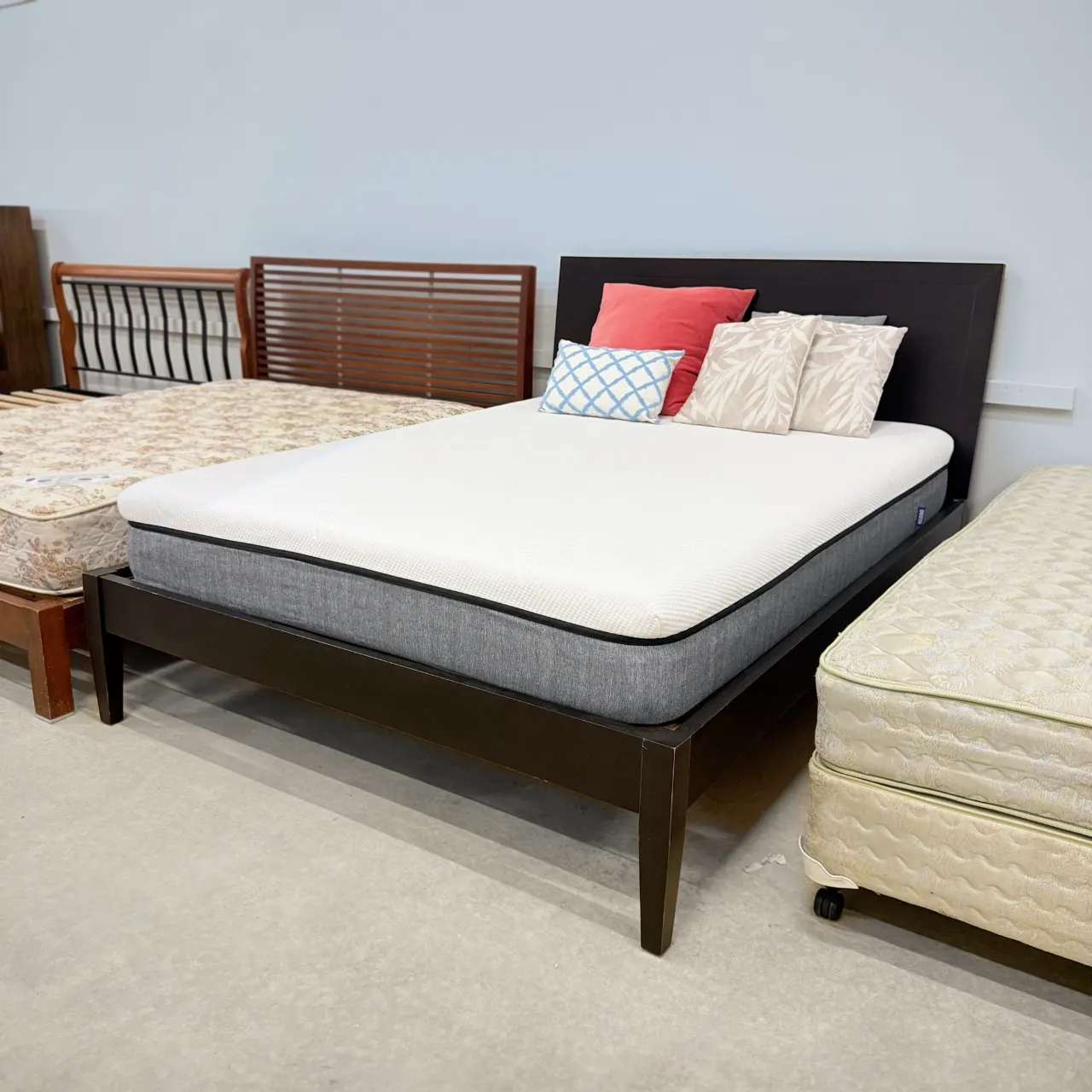 Espresso queen bed with mattress, three-quarter view