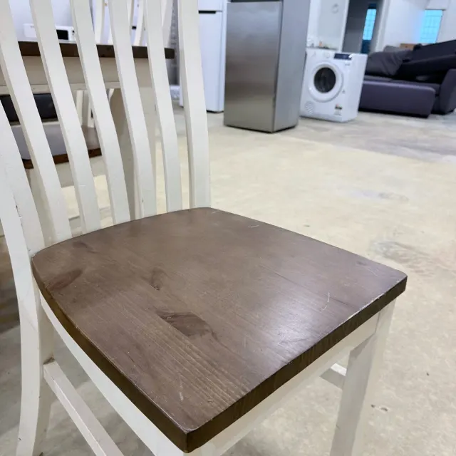 Shaped timber seat of the dining chair