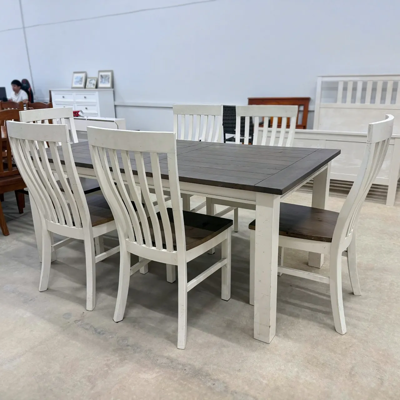 White dining set, angled view of the table and six chairs